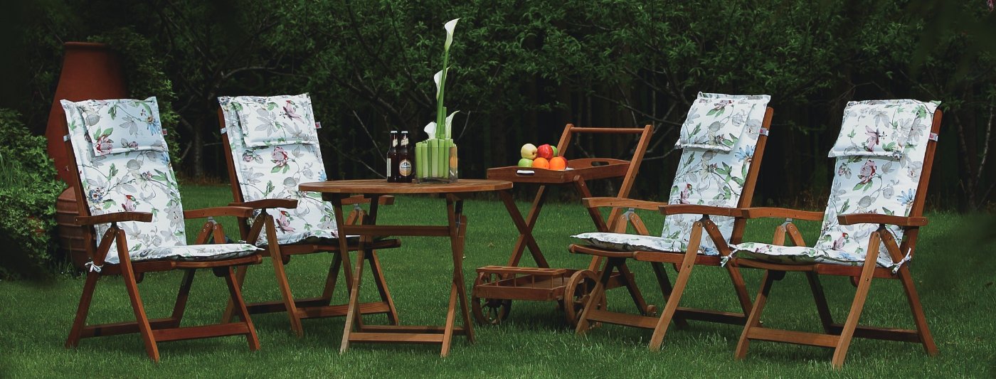 Outdoor dining set with striped cushions on the chairs
