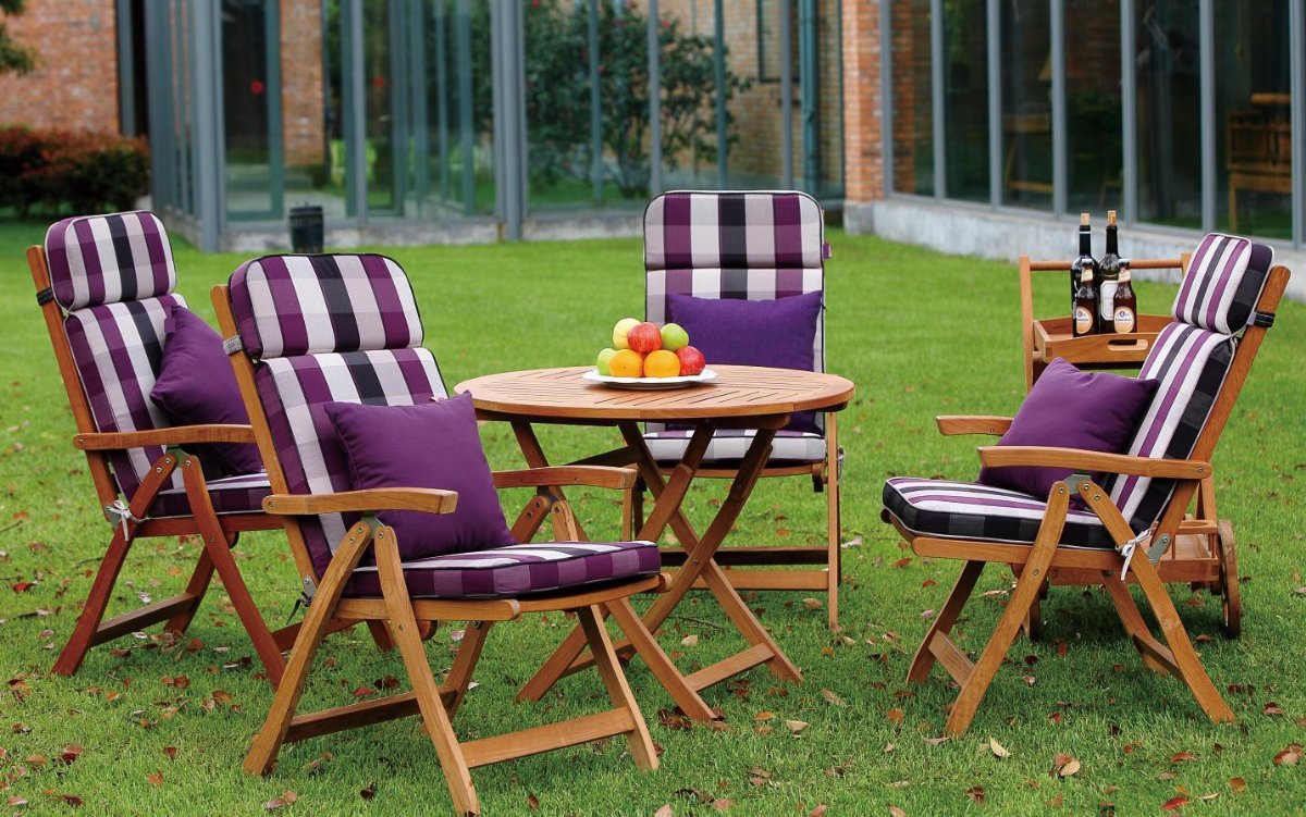 Purple and white striped outdoor lounge chair cushions with a matching side table